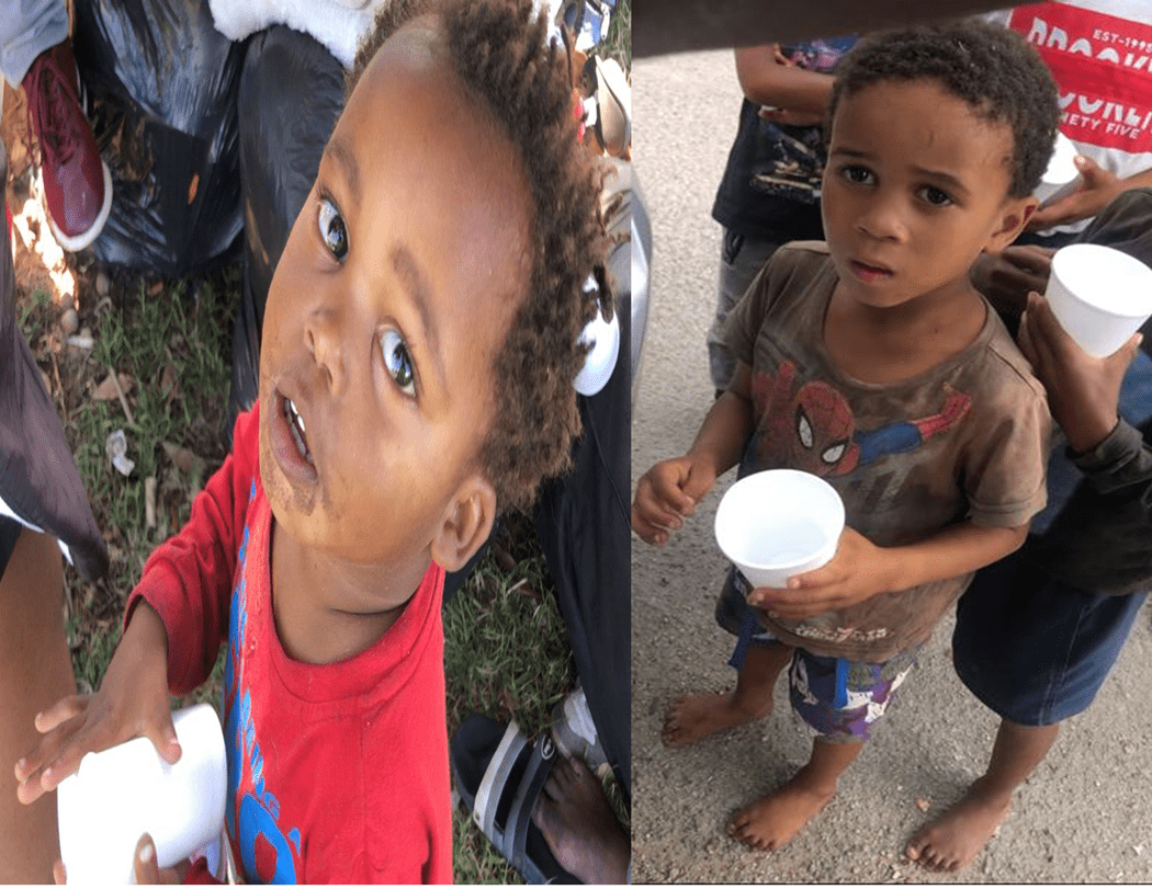 Giving juice drink to thirsty children